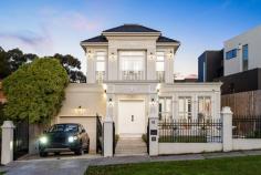  1A Viewhill Road Balwyn North VIC 3104 $3,300,000-$3,500,000 This brand new luxury mansion, positioned to impress on the global stage, stands as one of Balwyn North's most prestigious properties, showcasing opulent finishes and located within the highly sought-after Balwyn High School zone. Perched on the elevated side of the street, the home greets you with a beautifully landscaped front yard, complete with a water feature and grand double doors. As you step inside, your attention is immediately captured by a breathtaking marble spiral staircase, an exquisite architectural feature that sets the tone for the grandeur throughout. The formal lounge continues the elegance with coffered ceilings, marble flooring, offering a refined space for relaxation or entertaining. Conveniently located ground-floor bedroom with its own ensuite provides an ideal retreat for guests or family members seeking extra privacy and comfort. At the heart of the home, the state-of-the-art kitchen is equipped with Miele appliances and stunning marble benchtops and, flowing effortlessly into the dining and family areas. This space is further enhanced by a butler's kitchen and a generous walk-in pantry. The open-plan design extends outdoors through to a sophisticated alfresco entertaining area, featuring an outdoor kitchen, a landscaped backyard with pool/spa, lawn, and an elevated outdoor space. A standout feature is the full basement, offering a private haven with an additional ensuite bedroom and a spacious living area-perfect for extended family, guests, or a secluded retreat. This lower level provides versatility and added privacy, extending the living and entertaining potential of the home. Ascending the magnificent marble staircase, you're welcomed by the remaining three bedrooms are all robed and en-suited, with the master suite standing out with a private balcony and a lavish ensuite featuring twin vanities and a freestanding bathtub. Luxurious finishes such as plush carpets in the bedrooms, wainscoting, coffered ceilings, chandeliers, ducted heating/air conditioning, and lofty ceilings are just some of the many highlights. The property also includes a double garage with internal access and electric driveway gates for added security and convenience. 