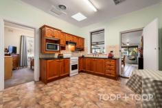 3 Ayr St Pooraka SA 5095 This extremely special offering on approx. 944sqm of land was designed and actually hand built by the original couple, taking approx. 4 years to complete by themselves with the assistance of family members in approx. 1950. This much loved long term family home has been in the one family for over 75 years now, and provides the very lucky and savvy new owners ample opportunity to either live in as it currently stands, update to their taste, renovate &/or extend (S.T.P.C.) or build your dream home (S.T.P.C.). Development could be possible (S.T.P.C.). The home is extremely comfortable and consists of 3 very good size bedrooms, pristine original bathroom with bath and shower with separate toilet. The formal lounge is located at the front of the home with heater and views to the front lawn. The rear open plan living and dining area is spacious and provides picture perfect views out to the immaculate and manicured rear gardens and lawned areas. The kitchen offers plenty of space which looks into the living area and out to the rear yard. Other features; Multiple garaging and under cover parking for up to 5 vehicles. Off street parking for caravans, boats, trailers, work vehicles + multiple cars. Ducted reverse-cycle air-conditioning throughout the original part of the home. Approx. 2.8m ceiling height in the original section of the home with 90's extension. Built-in robe & ceiling fan to bedroom 1 with built-in robe to bedroom 2. Multiple fruit trees with garden beds with overhead irrigation. Great outdoor entertaining area with built-in BBQ. Security shutters on most windows. Garden sheds and water tanks. Much, much more. This highly desirable home is located at the end of a quiet court directly opposite Dry Creek and within easy walking distance to beautiful parks, playgrounds, Lindblom Park, Pooraka Football Club, Pooraka Primary School and a short distance from Roma Mitchell College, Endeavour College, University of SA - Mawson Lakes Campus, shopping centres, cafes restaurants and much more.