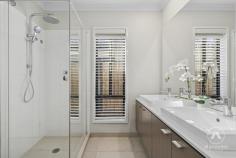 12 Kumbatine Street Pimpama QLD 4209 Welcome to 12 Kumbatine Street, a beautifully presented Plantation Homes build that perfectly blends modern comfort with family-friendly living in the heart of Gainsborough Greens. Built in 2018 and set on a 375m² block, this home has been thoughtfully designed to suit the busy lifestyle of Queensland families who value both style and convenience. Step inside and you’ll immediately feel the sense of space created by impressive 2.7m ceilings and hybrid flooring that flows through the open plan design. The gourmet kitchen, complete with stone benchtops, a 900mm cooktop, oven, and a walk-in pantry, is a dream for anyone who loves to cook or entertain. Overlooking the dining and living areas, the space seamlessly connects to the covered alfresco, making it easy to enjoy indoor-outdoor living and hosting all year round. Families will love the separate kids’ retreat, a bonus second living area that keeps everyone connected but gives the little ones their own space. All four bedrooms are fitted with built-in robes, while the master bedroom offers the luxury of a walk-in robe. The bathrooms have been designed with everyday families in mind, featuring stone benchtops and double vanities for that extra touch of elegance. Practicality hasn’t been overlooked either, with split system air-conditioning, a double garage, and the unbeatable convenience of being within walking distance to shops, schools, and everything that makes Gainsborough Greens such a sought-after area. Key Features – 375m² block built by Plantation Homes in 2018 – 4 bedrooms with built-in robes, master with walk-in robe – Open plan living and dining flowing to alfresco – Separate kids’ retreat for flexible family living – Kitchen with 900mm appliances, stone benchtops, and walk-in pantry – Bathrooms with double vanities and stone finishes – 2.7m ceilings and hybrid flooring throughout – Split system air-conditioning and double garage – Walking distance to local shops and schools This home is all about lifestyle-modern, low-maintenance, and ready for you to simply move in and enjoy.