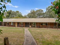 203 Tulley Road Lima East VIC 3673 $795,000 - $860,000 A rare country retreat offering space, privacy and endless potential. Set on a picturesque parcel surrounded by established trees and natural bushland, this expansive homestead delivers the tranquillity of rural living with room for the whole family. The long, wide verandah frames the home beautifully, creating a classic country feel and providing the perfect spot to sit back and take in the peaceful outlook. Inside, the floorplan is generous, with multiple living zones including a huge lounge with an open fireplace, large windows drawing in natural light, and views across the grounds. The kitchen and adjoining meals area offer plenty of space and storage, while the additional dining/living area gives flexibility for family living or entertaining. Accommodation includes three well-proportioned bedrooms, the main featuring an ensuite, plus a central bathroom and separate powder room. A mudroom, full laundry and excellent storage throughout add practical convenience. Outdoors, the property is designed to make the most of its rural setting, with established gardens, sweeping lawns, multiple sheds, water tanks, and a circular driveway for easy access. The large carport provides covered parking and direct entry to the home. A fantastic opportunity for those seeking a lifestyle change, a renovation project, or a peaceful retreat within easy reach of Mansfield and the High Country's attractions. Ready to enjoy now, with enormous potential to modernise or personalise. Key Features - Expansive country homestead with wide verandahs - Multiple spacious living zones including a large lounge with open fireplace - Three bedrooms, main with ensuite - Central bathroom plus separate powder room - Large kitchen with adjoining meals area - Additional dining/living space - Mudroom and full laundry - Established gardens and mature trees - Multiple sheds and water tanks - Large carport with direct access to the home - Circular driveway and excellent access around the property - Peaceful bushland setting offering space and privacy This much-loved home is ready for new owners to bring their vision to life. This is an exciting opportunity to secure a true rural lifestyle.
