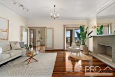 18 Ramsgate Road Kogarah Bay NSW 2217 Set on an impressive 676.5sqm (approx) elevated corner block with a prized 38.39-metre Lacey Street frontage, this substantial full-brick residence presents an exceptional opportunity for families, investors or developers. Positioned on a duplex site (STCA), the property combines immediate lifestyle appeal with outstanding long-term potential. Behind its classic facade lies a spacious and versatile home showcasing beautiful original mahogany timber floorboards, soaring 9.5ft ceilings, and a charming original fireplace with chimney. Generous formal and informal living and dining areas are enhanced by ceiling fans and multiple air-conditioning units, ensuring comfort year-round. The near-new kitchen (approximately 2 years old) is the heart of the home, featuring Caesarstone benchtops, gas cooktop, Whirlpool dishwasher, double sink, soft-close drawers and exceptional cupboard and pantry storage. It flows seamlessly to a vast undercover entertaining patio, overlooking sun-drenched, north-facing child-friendly lawns - ideal for relaxed family living and entertaining. Accommodation comprises four to five generous bedrooms, including a flexible study or home office. All bedrooms include built-in wardrobes, while the main bedroom enjoys double-glazed windows and block-out shutters for added comfort. A downstairs bedroom with ensuite and direct garden access is perfect for guests or in-law accommodation. The home also offers a modern main bathroom with separate bath and shower, an internal laundry with additional shower and toilet, gas hot water, and extensive under-house storage. Tightly held by only its second owner since 1960 approximately, this rare offering is located moments from Beverley Park Golf Club, local shops, transport options, and enjoys water glimpses toward Kogarah Bay. Complete with a double side-by-side lock-up garage with automatic doors plus valuable off-street parking, this is a unique opportunity combining space, quality, location and future potential.