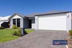 38 Mogumber Ave Midvale WA 6056 $849,000 Imagine weekend mornings where the coffee brews as you plan whether to explore the Perth Hills, head to the Swan Valley for lunch, or enjoy your private backyard oasis with friends and family. This 2022-built home in Midvale delivers the rare combination of as-new quality, contemporary design and a location that connects you to everything that makes Perth living special – without the wait, the worry or the builder’s delays. 4 bedrooms, 2 bathrooms 2022-built brick and iron Modern neutral palette Central open plan design Impressive outdoor living Zoned reverse cycle AC 32-course remote entry garage Solar panels 6.5 kW array 450sqm lot fully fenced Cool, close, contemporary Step through the front door and you’ll notice the quality immediately – large-format tiles in soft, warm tones flow underfoot, setting a calming mood that carries through the shared living spaces. The colour palette leans into muted greys and charcoal, creating a contemporary canvas that works with your furniture, your style, your life. The heart of this home is its light-filled, open-plan living area, where the family room, dining space, and kitchen merge in an expansive, effortless flow. Dual-aspect windows pull natural light deep into the plan, creating an airy atmosphere. There is enough room here for a generous modular sofa, a dining table that seats eight, and space left over for the kids to spread out with homework or play. The kitchen is equipped to meet the practical demands of family life, with a stone-topped island bench, a five-burner gas cooktop, an electric oven, and a dishwasher. A double sink signals attention to detail with its on-trend aesthetic, and modern pendant lights hang above the island, casting a warm glow for evening meals. The integrated breakfast bar becomes the morning gathering point, and a large cavity can accommodate a plumbed fridge – one less thing to organise when you move in. Privacy matters, and the principal bedroom delivers it by sitting at the front of the plan, separated from the family zones. The walk-in robe provides ample storage, and the ensuite – complete with a modern soaking tub – elevates the everyday routine into something restorative. After a long day, that tub becomes your best friend. The three junior bedrooms are a good size. 2x feature built-in robes and plush carpet underfoot. They share a well-appointed family bathroom that’s built to withstand the morning rush. A second living area creates flexibility for how you use the home – a media room, a playroom, a quiet reading space – and opens to the covered alfresco area. This is where summer evenings happen, where the barbecue gets fired up, where friends linger over drinks as the Perth sky shifts through sunset colours. The backyard strikes a perfect balance – the 450-square-metre block gives you space without the burden of endless maintenance. There’s a level lawn for children and pets, and enough room to garden if that’s your thing. A garden shed handles the practical storage, and the full fencing provides security and privacy. The remote-entry garage deserves special mention – built to 32 courses, it’s high enough for a raised four-wheel drive with a roof rack, and a rear roller door opens to a paved apron. This setup is gold if you own a boat, camper or trailer, providing secure storage that doesn’t compromise your street appeal. A 6.5-kilowatt solar array takes the sting out of electricity bills. Zoned reverse-cycle air conditioning means you’re not cooling or heating empty rooms. Blackout blinds in the bedrooms ensure sleep-ins when you need them. Low-maintenance landscaping at the front means less weekend gardening and more weekend living. Located in Midvale, you’re positioned between Perth’s eastern advantages. Midland’s city centre and train station sit roughly five minutes away by car, connecting you to the Perth CBD in under 30 minutes by train or around 25 minutes by car. Perth Airport is a 15-minute drive. Local schools, shops, and services cluster nearby, providing daily essentials. The Perth Hills unfold to the east – Mundaring, Kalamunda and John Forrest National Park within easy reach for weekend escapes. Head north and discover the Swan Valley’s wineries, breweries, and producers within 20 minutes. This home suits buyers who want to skip the construction chaos and move straight into contemporary comfort. Families will appreciate the space and layout. Professionals will value the location’s connectivity. Anyone tired of renovation projects will love that everything’s been decided, installed and finished. You simply bring your belongings and start living.