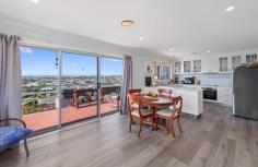 126 George St Devonport TAS 7310 $910000 Position and Versatility, Productivity and Visual Appeal 126 George Street would have to be among the best positioned homes in Devonport. Positioned to desired facilities, positioned to view Bass Strait, the city lights, the river mouth, the Western Tier mountain range. Set just below the crest of George Street overlooking the estuary of the Mersey River meeting Bass Strait with elevated views along the coast beyond Wright and Egg Islands and Moorlands and Northdown Beaches. This is a must see property if you are seeking prime property and location. Within 150 metres from St Brendan Shaw College, under a kilometre of Nixon St Primary School, Devonport High School, The Four Ways, Byard Park Sports complex, Devonport Surf Life Saving, Bluff Beach, Coles Beach, and only 1.7 kilometres to the City Centre; all within walking distance for an active family and convenient to all local schools and shopping precincts and recreation facilities. Such a versatile household, boasting at least four bedrooms, a family bathroom and two ensuites, studio/office options, formal lounge and 2nd living/rumpus. The house comprises two floors each with private access and vehicle accessways. The versatility extends to the living options beginning with access and convenience of all the essentials being on one level. Most two storey homes you enter and then climb; at 126 George you drive in, walk in and settle in; you may then proceed downstairs as necessary, however downstairs also has its own garage (with remote access), so on both levels you can drive in, walk in and settle in. When ready walk upstairs to the hub of the house which is the open plan kitchen-dining-living area and decking with the most captivating and expansive views. The views from the property are captivating in all weather conditions, at all times of day, and any time of year, from inside through the generous window area or outside on the deck or in the garden. Whether it be at sunrise over the coast as Devonport comes to life and the Spirit arrives from the horizon and enters the estuary to dock; during the day watching yachts in the strait sailing the breezes or at dusk as the city lights take effect and The Spirits’ of Tasmania glide back into Bass Strait lit up like a Christmas tree to slowly disappears toward the mainland. The current owners are active gardeners and the gardens are established with terraced levels featuring ornamental beds to the front of the house, while the secure gardens to the rear of the house are tended grow an abundance of fresh vegetable and fruit produce year round as they are in season. The easterly aspect and slope captures all the early morning sun and the position provides natural shelter from the prevailing south-westerlies the northern house front created a suntrap to help ripen the fresh produce. Produce grown includes runner and broad beans, cauliflower, leeks, rhubarb, cabbage, lettuce, spinach, tomatoes, corn, carrots, parsnips, cucumber and zucchini; Fruits include apples, fig, apricots, lemons, red currants and grapes. A new owner does not have to be as green fingered, but all the elements are in play. The property is situated on a moderate gradient, but the garden areas have been raised and terraced for ease of management and tending. This brick built and tile roofed house (Circa 1972) has had numerous upgrades during the current owners tenure including upgrading of the family bathroom, and second ensuite, new entry doorway, new glass balustrade to the deck, new flooring to living areas, and carpet to bedrooms, upgraded inbuilt robes, new roofing to carport, new down lights in the two living rooms plus kitchen and dining room, freshly painted interior where required, new gas hot water unit and as mentioned terracing and creation or renewal of raised garden beds for produce, and renewed front fences. The residence is both bright, well lit and ventilated as you would expect in a residence established to capture the scenery and surrounds, warmed when necessary by fan forced gas fire heater and supplemented when needed with ducted heating. The kitchen features electrical appliances – range, oven and dishwasher, plus walk in pantry. Set up an easel on the deck and paint or photograph the views, or sequester yourself at the house or on the deck with friends and family over a glass or cup of your favourite beverage and enjoy at your favourite time of day. This is a home for people who like to look outward, no need to shut the curtains if you like to wake with the sunrise. It is ideally suited to family living, provides generational family living opportunity, running a home office or studio; the options are enormous. Sushames Real Estate trusts in the information in this document which has been sourced from means which are considered reliable. Prospective purchasers are recommended to carry out their own due diligence regarding permits, measurements, and boundary positions prior to settlement. Inspections are strictly by appointment only. Please contact Neil on 0429 331 664 for further information. Features Balcony Ducted Heating Fully Fenced Gas Heating Remote Garage