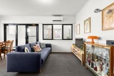 Unit 6/33 Rankins Rd Kensington VIC 3031 $450,000 Tremendous, trendy, tree house Featuring a tree top first floor position in a lively locale, moments to Parsons Street Park and Racecourse Road, this enormous one bedroom plus study apartment boasts two well-proportioned balconies and two rare under cover off street car spaces. Ideal for a home office–enter to your private study separated from living areas. Stainless steel kitchen appliances including a gas cooktop and dishwasher; ample bench space and breakfast bar preside over the kitchen with uninterrupted tree lined and pretty Victorian street scape views from the expansive picture window. Courtyard aspects welcome natural light into the living room, linked by a glass door to the undercover courtyard and all year-round alfresco dining with room for the largest BBQ. The double bedroom complete with a built-in robe and private courtyard also with picturesque views to tree lined Rankins Road is a quiet inner-city oasis. Split system heating/cooling also entices, as does the central bathroom with bath and separate shower. European laundry facilities include storage and separate laundry trough. Featuring ample natural light, above and beyond typical one bedroom accommodation and boasting tree lined views from every window and an airy feel, this is a property rarely seen and built at a time when space was a priority.