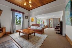112 David St East Devonport TAS 7310 $845,000 Timeless Circa 1888 Character Home on 1,234 m2 – A Rare East Devonport Gem Step back in time while enjoying modern comfort at 112 David Street, East Devonport. A beautifully preserved circa 1888 residence set on an expansive 1,234 m2 block. This charming four bedroom home blends historic elegance with thoughtful updates, offering space, warmth and lifestyle in equal measures. The home retains its classic character while offering the comfort and presentation today’s buyers seek. Garden & Lifestyle: A full-length picket fence offers additional privacy as well as being child and pet safe, a double carport adjoins a private deck area for early morning coffee or just to contemplate the day ahead. This property offers not just a home, but a lifestyle – space to grow your own produce, enjoy nature and relax in complete privacy. The lounge / living is of two components, features classic high ceiling lined in Tasmanian Oak. Quality block out drapes, as new carpet and painted with a neutral colour platelet throughout the home. The second living / lounge offers a more contemporary setting with lower ceiling, down lights and expansive windows leading to the huge deck area that overlooks the garden. The light and airy timber kitchen has gas cooking, as well as huge meal preparation areas, Ariston dishwasher plus ample room for a double refrigerator. The large adjoining dining area features ornate fireplace with desk alcove and multiple shelving for those special ornaments. There are two heat sources within the home, the hallway has a Mitsubishi reverse cycle air conditioner, the dining and lounge rooms have online gas. Sixteen solar panels and 3.7 kw inverter assist in reducing electrical consumption. The bedrooms are wide, spacious, spectacular polished floors, high ceilings as well as built ins in most rooms. Fireplaces are ornamental but could be reinstated should you choose. Bathroom/ Laundry, Powder room: All have been rebuilt over the last few years, tastefully furbished with classic features and authentic timber windows Homes of this era, on land of this size, are increasingly rare. Set on a massive 1,234 m2 parcel, the garden is a private sanctuary featuring an extraordinary variety of established trees and plants including Pear, Cherry, Walnut, Olive, Double grafted Apple, Lemon, Plum, Peach, Grape vines, Mulberry, Kumquats, Kiwi fruit, Tahitian lime, Ginko Biloba and Feijoa. A well – established greenhouse provides year – round greens and fresh herbs including Rosemary, Sage, Oregano and Fennel – perfect for the home cook or garden enthusiast, additional outdoor features include – Bird aviary, numerous storage sheds, private bee hives producing exceptionally sweet honey. Beautiful black parrots can be seen amongst the trees at certain times, their glossy feathers shimmering against a backdrop of lush green foliage. A garden of discovery, where natures elegance takes flight, with every visit brings you closer to nature. If you’ve been searching for character, charm and a remarkable garden setting, this is an opportunity not to be missed. Enquire today to experience this unique East Devonport treasure. Sushames Real Estate trusts in the information in this document which has been sourced from means which are considered reliable. Prospective purchasers are recommended to carry out their own due diligence regarding permits, measurements and boundary positions prior to settlement.