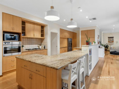 63 Wordsworth Ave Yokine WA 6060 Home Open : Saturday, 01-Aug-2026, 2:00 PM to 2:45 PM Auction Perfectly positioned opposite the tree-lined parklands of Yokine Regional Open Space and moments from the prestigious Coolbinia border, this exceptional custom-built single-level residence delivers the perfect balance of space, privacy and family living. Behind the striking rendered and limestone façade, a secure gated entrance welcomes you into a home where polished oak floors, soaring architectural windows and abundant natural light create an immediate sense of warmth and elegance. Every major living area enjoys beautiful outlooks to either the parklands or the stunning central courtyard. A dedicated home office near the entrance offers flexibility for working from home or guest accommodation, while the formal living and dining rooms feature custom cabinetry and picturesque parkland views. At the heart of the home, the beautifully appointed stone kitchen features a large peninsula island, quality appliances, extensive storage, a butler’s pantry and adjoining sitting nook—creating the perfect space for everyday family life and entertaining. The impressive U-shaped stone-paved courtyard fills the home with natural light before flowing through to the expansive open-plan family and dining area. Outside, enjoy your own private oasis with landscaped gardens, lush lawns, a lagoon-inspired below-ground swimming pool, timber decking and a circular stone conversation garden—an idyllic setting for entertaining family and friends all year round. The private bedroom wing offers excellent separation from the living areas and includes two generous secondary bedrooms with built-in robes, a stylish family bathroom and separate WC. The king-sized master suite provides a peaceful retreat with a fully fitted dressing room and luxurious ensuite. Additional features include Panasonic ducted reverse-cycle air conditioning, solar power, bore-reticulated gardens, ducted vacuum, alarm system, extensive storage, zoned living areas and a double garage. Homes of this calibre are becoming increasingly rare—single level, architecturally designed, beautifully maintained and positioned in one of Yokine’s most tightly held park-side locations. Location Highlights • Opposite Yokine Regional Open Space • Close to Terry Tyzack Aquatic Centre • Approximately 7km to Perth CBD • Mount Lawley Senior High School catchment • Close to Yokine Primary School, St Denis Catholic Primary School, Servite College and Chisholm Catholic College • Approximately 15 minutes to Perth’s coastline • Close to cafés, shopping and public transport ONSITE AUCTION | Saturday 15th August 2026 at 2:00pm | Offers Invited Prior For further details, please TEXT Mark and Debra Passmore on 0411 870 888 | 0411 888 138 or Ashleigh Passmore (PA) on 0438 832 200. ***Passmore Real Estate wishes to advise that whilst every care is taken in the preparation of these details, they MUST be verified if relied upon before entering into a contract of sale*** **Please note a selection of images contained in this advertisement have been digitally modified with AI to remove items that are not included in the sale of the property.**