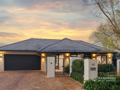 63 Wordsworth Ave Yokine WA 6060 Home Open : Saturday, 01-Aug-2026, 2:00 PM to 2:45 PM Auction Perfectly positioned opposite the tree-lined parklands of Yokine Regional Open Space and moments from the prestigious Coolbinia border, this exceptional custom-built single-level residence delivers the perfect balance of space, privacy and family living. Behind the striking rendered and limestone façade, a secure gated entrance welcomes you into a home where polished oak floors, soaring architectural windows and abundant natural light create an immediate sense of warmth and elegance. Every major living area enjoys beautiful outlooks to either the parklands or the stunning central courtyard. A dedicated home office near the entrance offers flexibility for working from home or guest accommodation, while the formal living and dining rooms feature custom cabinetry and picturesque parkland views. At the heart of the home, the beautifully appointed stone kitchen features a large peninsula island, quality appliances, extensive storage, a butler’s pantry and adjoining sitting nook—creating the perfect space for everyday family life and entertaining. The impressive U-shaped stone-paved courtyard fills the home with natural light before flowing through to the expansive open-plan family and dining area. Outside, enjoy your own private oasis with landscaped gardens, lush lawns, a lagoon-inspired below-ground swimming pool, timber decking and a circular stone conversation garden—an idyllic setting for entertaining family and friends all year round. The private bedroom wing offers excellent separation from the living areas and includes two generous secondary bedrooms with built-in robes, a stylish family bathroom and separate WC. The king-sized master suite provides a peaceful retreat with a fully fitted dressing room and luxurious ensuite. Additional features include Panasonic ducted reverse-cycle air conditioning, solar power, bore-reticulated gardens, ducted vacuum, alarm system, extensive storage, zoned living areas and a double garage. Homes of this calibre are becoming increasingly rare—single level, architecturally designed, beautifully maintained and positioned in one of Yokine’s most tightly held park-side locations. Location Highlights • Opposite Yokine Regional Open Space • Close to Terry Tyzack Aquatic Centre • Approximately 7km to Perth CBD • Mount Lawley Senior High School catchment • Close to Yokine Primary School, St Denis Catholic Primary School, Servite College and Chisholm Catholic College • Approximately 15 minutes to Perth’s coastline • Close to cafés, shopping and public transport ONSITE AUCTION | Saturday 15th August 2026 at 2:00pm | Offers Invited Prior For further details, please TEXT Mark and Debra Passmore on 0411 870 888 | 0411 888 138 or Ashleigh Passmore (PA) on 0438 832 200. ***Passmore Real Estate wishes to advise that whilst every care is taken in the preparation of these details, they MUST be verified if relied upon before entering into a contract of sale*** **Please note a selection of images contained in this advertisement have been digitally modified with AI to remove items that are not included in the sale of the property.**