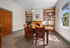 112 David St East Devonport TAS 7310 $845,000 Timeless Circa 1888 Character Home on 1,234 m2 – A Rare East Devonport Gem Step back in time while enjoying modern comfort at 112 David Street, East Devonport. A beautifully preserved circa 1888 residence set on an expansive 1,234 m2 block. This charming four bedroom home blends historic elegance with thoughtful updates, offering space, warmth and lifestyle in equal measures. The home retains its classic character while offering the comfort and presentation today’s buyers seek. Garden & Lifestyle: A full-length picket fence offers additional privacy as well as being child and pet safe, a double carport adjoins a private deck area for early morning coffee or just to contemplate the day ahead. This property offers not just a home, but a lifestyle – space to grow your own produce, enjoy nature and relax in complete privacy. The lounge / living is of two components, features classic high ceiling lined in Tasmanian Oak. Quality block out drapes, as new carpet and painted with a neutral colour platelet throughout the home. The second living / lounge offers a more contemporary setting with lower ceiling, down lights and expansive windows leading to the huge deck area that overlooks the garden. The light and airy timber kitchen has gas cooking, as well as huge meal preparation areas, Ariston dishwasher plus ample room for a double refrigerator. The large adjoining dining area features ornate fireplace with desk alcove and multiple shelving for those special ornaments. There are two heat sources within the home, the hallway has a Mitsubishi reverse cycle air conditioner, the dining and lounge rooms have online gas. Sixteen solar panels and 3.7 kw inverter assist in reducing electrical consumption. The bedrooms are wide, spacious, spectacular polished floors, high ceilings as well as built ins in most rooms. Fireplaces are ornamental but could be reinstated should you choose. Bathroom/ Laundry, Powder room: All have been rebuilt over the last few years, tastefully furbished with classic features and authentic timber windows Homes of this era, on land of this size, are increasingly rare. Set on a massive 1,234 m2 parcel, the garden is a private sanctuary featuring an extraordinary variety of established trees and plants including Pear, Cherry, Walnut, Olive, Double grafted Apple, Lemon, Plum, Peach, Grape vines, Mulberry, Kumquats, Kiwi fruit, Tahitian lime, Ginko Biloba and Feijoa. A well – established greenhouse provides year – round greens and fresh herbs including Rosemary, Sage, Oregano and Fennel – perfect for the home cook or garden enthusiast, additional outdoor features include – Bird aviary, numerous storage sheds, private bee hives producing exceptionally sweet honey. Beautiful black parrots can be seen amongst the trees at certain times, their glossy feathers shimmering against a backdrop of lush green foliage. A garden of discovery, where natures elegance takes flight, with every visit brings you closer to nature. If you’ve been searching for character, charm and a remarkable garden setting, this is an opportunity not to be missed. Enquire today to experience this unique East Devonport treasure. Sushames Real Estate trusts in the information in this document which has been sourced from means which are considered reliable. Prospective purchasers are recommended to carry out their own due diligence regarding permits, measurements and boundary positions prior to settlement.