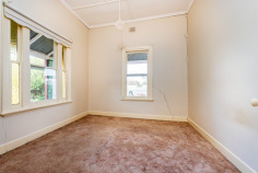 60 Allan St Henty NSW 2658 $369,000 Rich in character and brimming with opportunity, this charming double-brick Federation-style home offers the perfect foundation for those looking to restore, renovate, extend or explore future development possibilities. Positioned on a generous corner allotment with frontage to two streets, the property presents exciting potential for future improvements, including the possibility of extending the existing residence or investigating the addition of a second dwelling (STCA). Showcasing many of the timeless features that make Federation homes so enduringly popular, the residence is welcomed by a classic half wrap-around verandah, providing the perfect place to relax, entertain guests or simply enjoy the peaceful township surroundings. Inside, a traditional central hallway reflects the architecture of the era, leading to two generous front bedrooms and a formal lounge room. Original character features remain throughout, including an open fireplace that extends into one of the front bedrooms, offering the opportunity to restore this beautiful focal point if desired. A split-system air conditioner provides year-round comfort. The spacious eat-in kitchen is functional as is, while also offering ample scope for a future renovation to create a modern family hub that complements the home's period charm. To the rear of the home, an enclosed verandah has been transformed into an additional living space, ideal as a third bedroom, home office, hobby room or sleepout. The home is further serviced by a main bathroom, separate toilet and laundry facilities. Outside, the large corner allotment provides outstanding flexibility for the future-minded purchaser. Whether you're seeking extra space for vehicles, caravans, workshops or considering future development opportunities, the substantial shed and dual-street access create endless possibilities. Conveniently located within walking distance of Henty's shopping precinct, schools, swimming pool, golf course, bowling club and sporting facilities, this is a rare opportunity to secure a character home with genuine future potential. Whether you're an owner-occupier seeking a rewarding renovation project, a family looking for room to grow, or an investor with an eye on future development, this property offers charm, flexibility and exciting possibilities in equal measure.