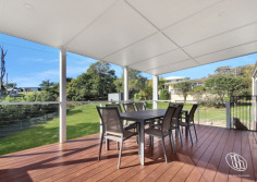 28 Thomson Parade Dalmeny NSW 2546 $765,000 North-Facing Living, Lake Views & Endless Lifestyle Appeal This well presented single-level home in Dalmeny, where comfort, practicality and relaxed living come together. Filled with natural light, the open plan living and dining area features reverse cycle air conditioning and a cosy fireplace, creating the perfect space to enjoy all year round. Designed with entertaining in mind, the living area seamlessly extends to a generous north-facing covered deck, where you can unwind while taking in the peaceful outlook across Mummaga Lake. At the heart of the home is a well-appointed kitchen offering ample bench space, abundant storage and a breakfast bar for casual dining. There are three comfortable bedrooms, each complete with ceiling fans, while two feature built-in wardrobes for added convenience. The bathroom offers a touch of luxury with underfloor heating, while a separate laundry completes the home's practical layout. Downstairs, a substantial workshop with an adjoining outdoor landing provides the ideal space for hobbies, storage, or conversion to a home office. Outside, the property continues to impress with ample off-street parking for multiple vehicles. Side access provides additional space for a caravan, trailer or boat, making this an ideal home for those who love the outdoors and the coastal lifestyle. The rear yard is fully fenced and an ideal space for kids and pets. We have obtained all information in this document from sources we believe to be reliable; however, we cannot guarantee its accuracy. Prospective purchasers are advised to carry out their own investigations...