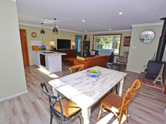 35 Shackleton St Robertson NSW 2577 PLENTY OF ROOM & PRIVATELY POSITIONED FAMILY HOME ON APPROX 1330SQM You'll only see the hedge rimmed drive into No 35 until the block opens out at the gateway to a wide fully fenced expanse - park the weekender van or tradie's truck within eyesight. The comfortable home is well sited with a large secure front yard for the children & pets to play safely and also offers access either side to the north facing rear garden. The entry hall leads into an open plan living, kitchen & dining area with loads of light through large windows north and south. The kitchen features a wide servery (or preparation) bench perfect for the quick brekkie or evening drinks whilst dinner is on the way with the dining table close by. The main bedroom is off to the right with a partial wall of robes to disguise the cutest ensuite. The western side of the home has a spacious 3-way main bathroom with 3 more bedrooms for the growing family. The internal laundry doubles as a butler's pantry with easy access outside. The very private rear garden is bathed in northern sun with a rural outlook towards the 5 acre lots that front onto Lemmons Road - not likely to be built out - and also features a 'guest shed' with high ceilings to living area, separate bedroom + ensuite. Beautifully styled and quite the retreat ! PRIVACY, SPACE & IN A QUIET PLACE...come see me.