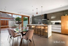 14 Havelock St St Kilda VIC 3182 $1,850,000 - $1,950,000 A contemporary icon near the foreshore Expressions of Interest Closing 1 September at 2:30pm Morning swims, weekends at Donovans and Melbourne's celebrated beachside lifestyle are all part of the address, yet behind its striking timber-clad façade, this four bedroom, architect-designed residence delivers one of St Kilda's most compelling contemporary homes. Sustainable passive design makes exceptional use of natural light, allowing rich natural materials, expansive glazing and beautifully connected living spaces to define a home of impressive family proportions. The dramatic open-plan living and dining domain leaves an immediate impression beneath soaring skylights, with natural light illuminating a rich palette of Calacatta marble, concrete and American oak. Premium ILVE appliances and a generous walk-in pantry complete the kitchen, while oversized timber stacker doors transform the private entertaining terrace into a natural extension of the living spaces. Upstairs, a generous second living area opens to a north-west balcony through double-glazed sliding doors, accompanied by three bedrooms and a beautifully appointed bathroom. Occupying its own private level above, the king-sized main suite enjoys complete separation and serenity, with a walk-in robe, twin-shower ensuite, and a sun-drenched balcony. A flexible ground-floor bedroom or home office with a reclaimed timber desk, extensive robes and an adjoining third bathroom adds exceptional flexibility for guests or multi-generational living. Just moments from the foreshore, St Kilda Sea Baths, Albert Park Lake, Catani Gardens, excellent schools and city-bound Routes 96 and 16 trams, this impressive home is further enhanced by solar panels, ground-floor in-slab heating, split-system heating and cooling, double glazing, electric blinds to the main bedroom, keyless entry, an alarm, a European laundry and extensive storage throughout.