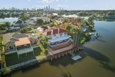 32 Montevideo Dr Clear Island Waters QLD 4226 Solid Concrete Waterfront with Exceptional Wide-Water Views Positioned on a highly sought-after waterfront block in Clear Island Waters, 32 Montevideo Drive presents a substantial family home with exceptional construction, generous proportions and outstanding outdoor living. Built from solid concrete with a suspended concrete slab, the home offers excellent structural integrity and genuinely great bones. With six bedrooms, four bathrooms and two ensuites, there is ample space for large or extended families. Multiple living areas provide flexibility for everyday living, entertaining and working from home. A separate multipurpose room features its own private entrance, making it ideal as a home office, consulting room, guest retreat or additional living space. The expansive outdoor entertaining area overlooks exceptionally wide water and connects to a full-width boardwalk and private pontoon. Positioned on the northern side of the block, the swimming pool enjoys all-day sunshine and creates the perfect setting for relaxed waterfront living. Energy efficiency and modern convenience are also well covered, with a substantial 13kW solar system, 26kWh battery, electric vehicle charger, security cameras and split-system air conditioning. Additional features include a recently repointed and repainted roof, resin flooring to the garage, extensive storage throughout and generous indoor and outdoor areas. Property Features ✓ Six bedrooms and four bathrooms ✓ Two ensuites ✓ Solid concrete construction with suspended concrete slab ✓ Multiple living and entertaining areas ✓ Multipurpose room or home office with separate entrance ✓ North-facing swimming pool with all-day sun ✓ Exceptionally wide waterfront outlook ✓ Expansive covered outdoor entertaining area ✓ Full-width waterfront boardwalk ✓ Private pontoon ✓ 13kW solar system ✓ 26kWh battery storage ✓ Electric vehicle charger ✓ Split-system air conditioning ✓ Security camera system ✓ Recently repointed and repainted roof ✓ Resin garage flooring ✓ Extensive storage throughout Offering space, strength and an exceptional waterfront lifestyle, this is a rare opportunity to secure a substantial home in one of Clear Island Waters’ most tightly held locations.