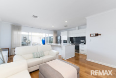 46 Aureate Way Eglinton WA 6034 750,000 Coastal Elegance Meets Everyday Luxury – Walk to the Beach, Dine by the Ocean, Love Where You Live Perfectly positioned in the highly sought-after coastal community of Amberton Beach, this beautifully presented home offers the ideal blend of modern comfort, quality craftsmanship, and an enviable beachside lifestyle. Just a short stroll from the pristine shoreline and the ever-popular The Amberton Beach Bar & Kitchen, you'll enjoy breathtaking panoramic ocean views, delicious meals, and unforgettable sunsets that make every evening feel like a holiday. Amberton Beach is renowned for its welcoming community atmosphere, expansive parklands, walking trails, and family-friendly lifestyle. With the Mitchell Freeway extension, train station, newly opened shopping centre, and excellent schools all just minutes away, you'll enjoy the perfect balance of coastal tranquility and everyday convenience. From the moment you arrive, this home impresses with its striking street appeal, low-maintenance front gardens, feature entry door complete with a security flyscreen, and ample street parking for family and guests. Step inside to discover soaring ceilings, quality skirting boards and cornices, and beautiful wood-effect laminate flooring that flows seamlessly throughout the home, creating a warm and sophisticated coastal ambience. Designed for comfortable living and effortless entertaining, the spacious open-plan living, dining, and kitchen area forms the heart of the home. Bathed in natural light, this inviting space extends effortlessly through sheer curtains to the impressive alfresco entertaining area. Featuring a raised roof and a stunning whitewashed feature wall, the outdoor living space perfectly captures the relaxed coastal charm that Amberton Beach is famous for. The kitchen is a true showpiece, combining style with functionality. A generous island bench finished with elegant white stone benchtops provides the perfect gathering place for family and friends, while an abundance of quality cabinetry above and below the benchtops ensures exceptional storage. Complete with a dishwasher, 900mm oven, five-burner cooktop, and a double-door fridge recess, this kitchen is designed to impress both home cooks and entertainers alike. The king-sized master suite is a luxurious private retreat featuring French plantation shutters, a spacious walk-in robe, and a beautifully renovated ensuite finished to a high standard. Bedrooms two and three continue the home's quality theme with laminate flooring, double mirrored sliding robes, and elegant French plantation shutters. The stylishly renovated family bathroom has also been tastefully updated, while both bathrooms have been professionally epoxy grouted, providing peace of mind with an impressive 25-year warranty. Practicality has not been overlooked, with a well-appointed laundry featuring a separate toilet and linen recess, a fully enclosed double garage, and a low-maintenance backyard allowing you to spend more time enjoying the coastal lifestyle rather than maintaining the garden. Comfort is assured year-round thanks to the reverse-cycle ducted and zoned air conditioning system, while the 6.6kW solar panel system helps keep energy costs down. Security is enhanced with two surveillance cameras, positioned at the front of the home and the alfresco area, both connected to a DVR recording system. This is more than just a home—it's an opportunity to embrace one of Perth's most desirable coastal lifestyles, where morning beach walks, afternoon swims, and spectacular sunsets become part of your everyday routine. If you've been searching for a home that offers quality finishes, thoughtful upgrades, low-maintenance living, and an unbeatable beachside location, this stunning Amberton Beach residence is one you simply cannot afford to miss. Arrange your inspection today and discover why so many people are proud to call this exceptional coastal community home.